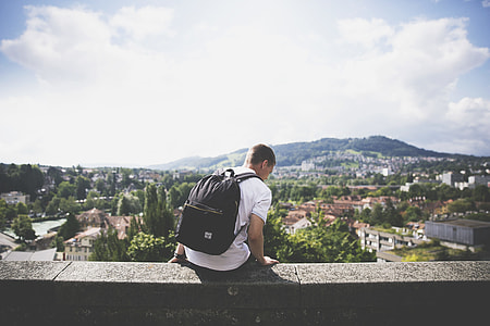 man sitting on ledge thumbnail