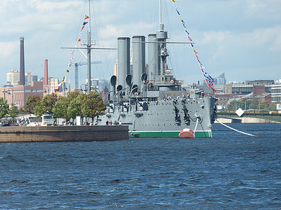 grey tank ship parked on dock during day thumbnail