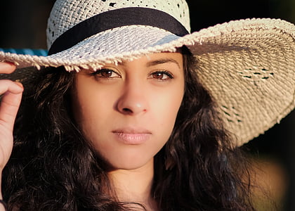 woman wearing white hat during daytime thumbnail