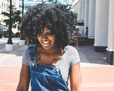 Woman in Gray Scoop-neck Shirt and Blue Denim Overalls thumbnail