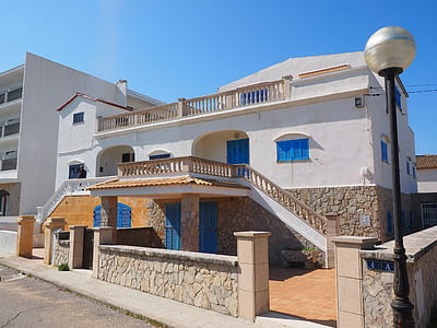 white and brown concrete house thumbnail