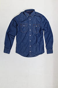 blue denim dress shirt on white surface thumbnail