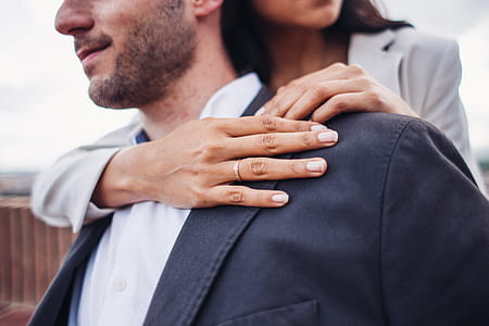 A caucasian couple embraces outdoors thumbnail