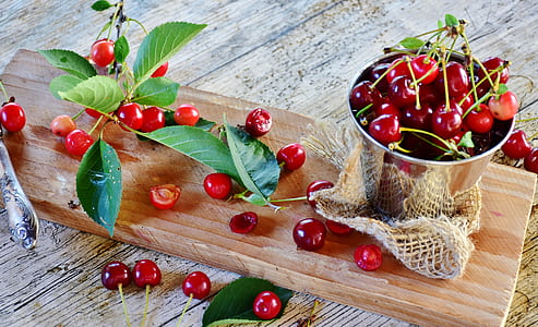 red berries on brown wooden board thumbnail