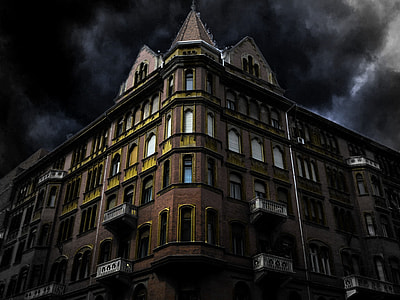 low-angle photography of high rise building at night thumbnail