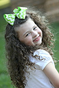 girl in white shirt smiling thumbnail