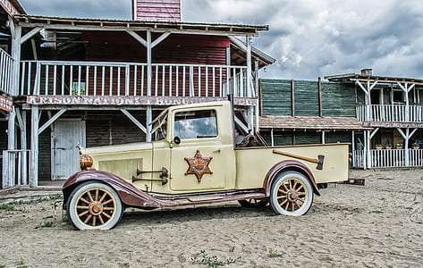 vintage brown single cab truck under blue sky thumbnail