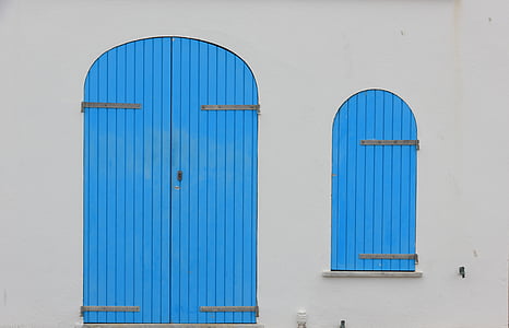 closed blue wooden door thumbnail