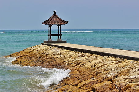 brown gazebo near body of water thumbnail