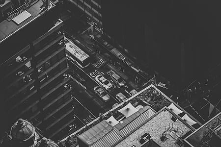 grayscale photography of moving vehicles on road thumbnail