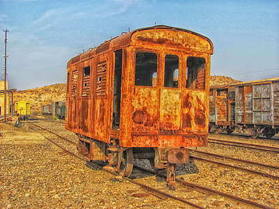 close-up photo of brown train trailer on rail thumbnail