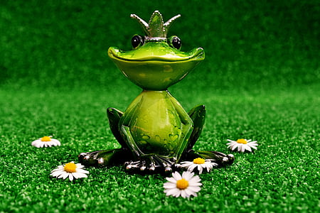 green fog figurine near white daisies thumbnail