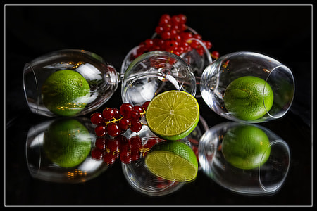 lemon with glasses and grapes close-up photography thumbnail