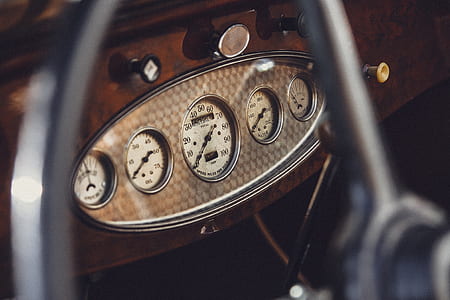 selective focus photography of vehicle speedometer thumbnail