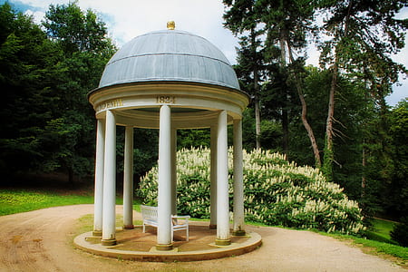 white gazebo surrounded by grass thumbnail