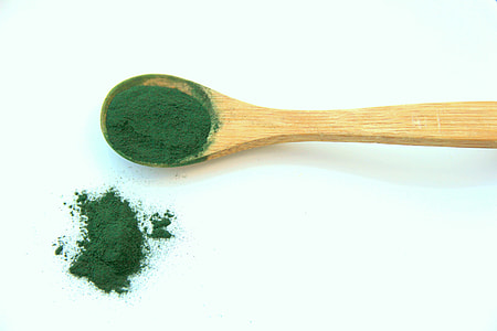wooden spoon with green powder thumbnail