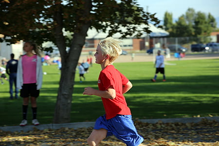 boy running near tree thumbnail