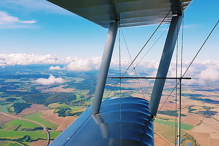 white and gray bi-plane on air thumbnail