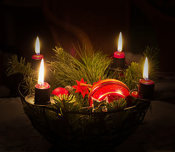 red lighted candles on mesh basket thumbnail