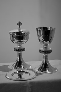 two silver chalices on table thumbnail