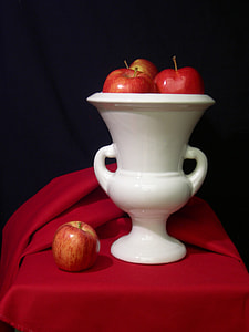red apples on white ceramic vase thumbnail
