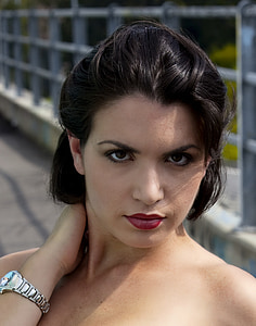 woman in black hair near grey metal rail thumbnail