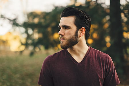 man facing sideways with trees background thumbnail