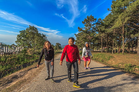 Man and Two Women Walking thumbnail