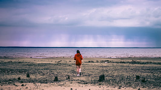 woman standing near shore thumbnail