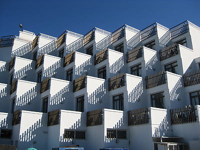 white concrete residential buildings during daytime thumbnail