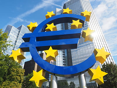 blue and yellow Euro symbol billboard near white high-rise building low-angle photography thumbnail