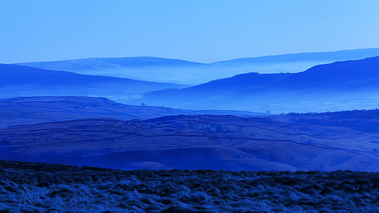 silhouette photo of mountains at nighttime thumbnail