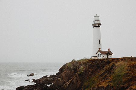 lighthouse near body of water thumbnail