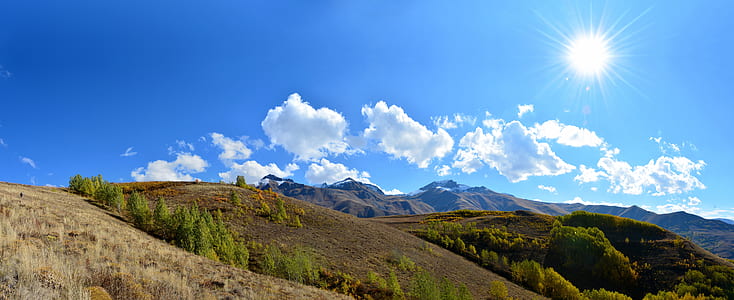 green mountain during daytime thumbnail
