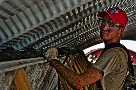 close up photo of man in red cap with eye protector thumbnail