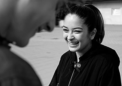 woman wearing black zip-up hooded jacket thumbnail