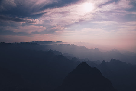 aerial photography of mountains under clouds thumbnail