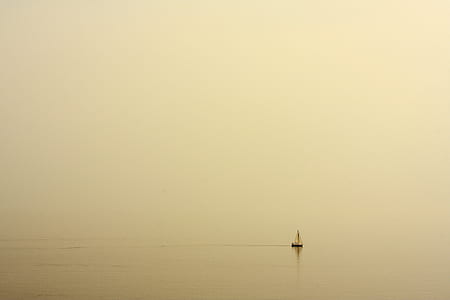 white sailboat on water at daytime thumbnail