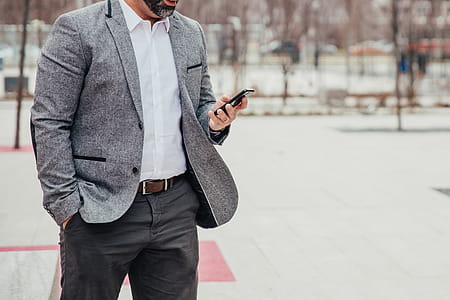 Business Man Checks Mobile Photo thumbnail