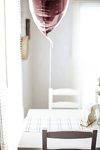brown balloon on white wooden chair thumbnail