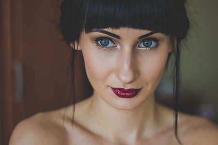 woman with maroon lipsticks and false mascara thumbnail