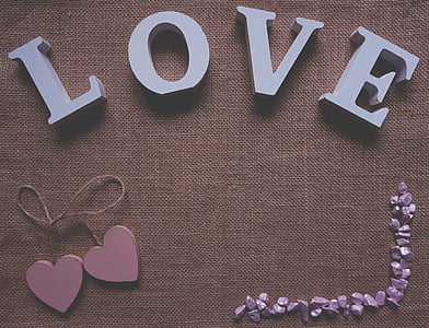 four white cutout lettering on brown mat thumbnail
