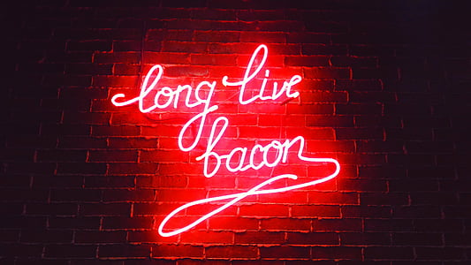 red long live bacon neon light signage on brown wall thumbnail