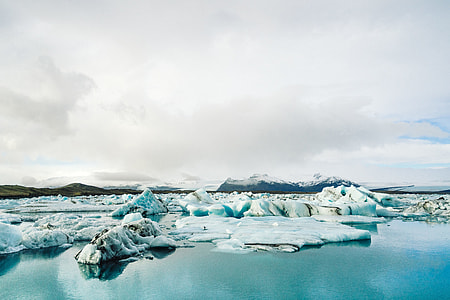 photo of iceberg and calm body of water at daytime thumbnail