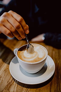 Cup of coffee on table in cafe thumbnail