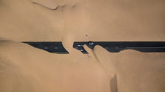 Black Road Covered With Sand thumbnail