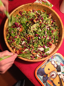 Mixing Salad with Onions with greens and carrots thumbnail