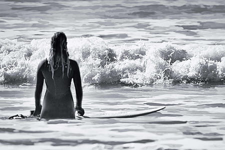 grayscale photo of woman surfer thumbnail