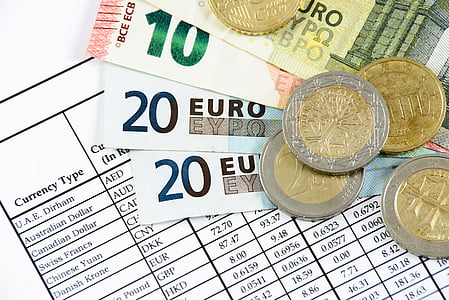 four 10 and 20 Euro banknotes and coins thumbnail