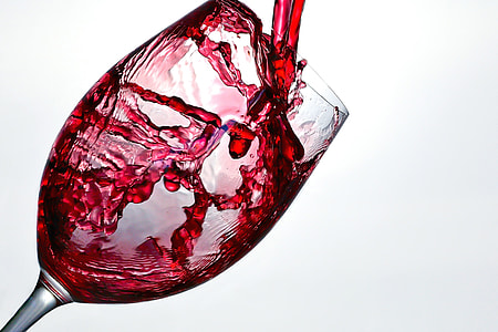 Red wine poured in glass thumbnail